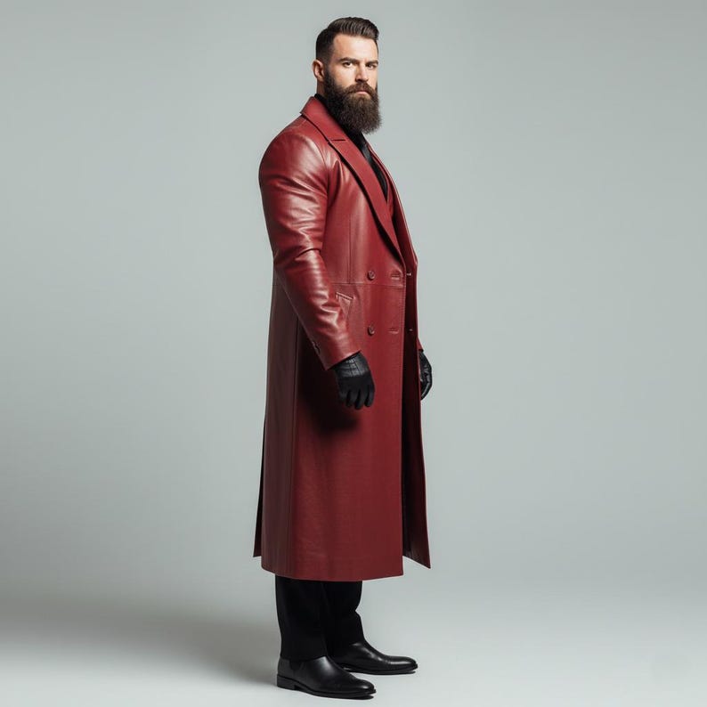 May include: A long, burgundy leather coat with a double-breasted design. The coat features a classic lapel and a long, flowing silhouette. The person is wearing black gloves, black pants, and black shoes.