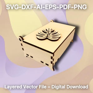 Könnte beinhalten: Eine hellfarbene Holzkiste mit einem dekorativen Blattdesign auf dem Deckel. Die Kiste ist rechteckig mit kleinen Beinen und trägt den Text "SVG-DXF-AI-EPS-PDF-PNG" und "Layered Vector File - Digital Download".
