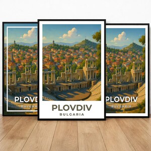 May include: Three framed art prints featuring a scenic view of Plovdiv, Bulgaria. The artwork depicts an ancient amphitheater in the foreground, with a cityscape and rolling hills in the background. The prints have a white border and the text "Plovdiv Bulgaria".
