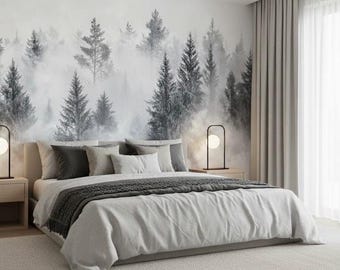 May include: A contemporary bedroom featuring a forest-themed mural. The bed is made with a white duvet, grey throw, and several pillows. Two black lamps with globe-shaped bulbs sit on wooden bedside tables. Grey curtains and a light-coloured rug complete the room.