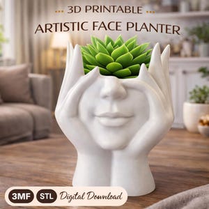 Peut inclure: Un pot de fleurs blanc imprimé en 3D en forme de visage souriant, contenant une plante succulente verte. Les mains du pot sont positionnées sur le visage. Le texte sur l'image indique "... 3D Printable ARTISTIC FACE PLANTER" et "Digital Download".