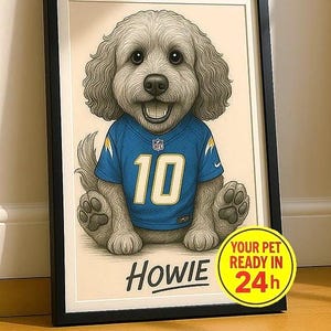 May include: Framed artwork featuring a smiling dog wearing a blue jersey with the number 10. The dog's name, "Howie," is below the image. A yellow circle indicates the artwork is ready in 24 hours. The artwork is in a black frame.