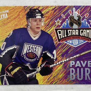 May include: A rustic wooden sign with the text "Welcome to our home" in white lettering. The sign features a distressed finish and a simple, inviting design, perfect for entryway decor.