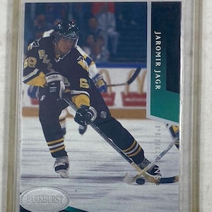 May include: A hockey trading card featuring Jaromir Jagr in a Pittsburgh Penguins uniform. The card has a green and white border with the player's name. The Parkhurst logo is visible at the bottom. The player is in action on the ice.