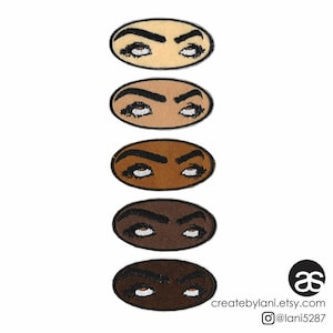 May include: Five embroidered iron-on patches featuring a pair of eyes with arched eyebrows. The patches are oval-shaped and come in five different skin tones: light, medium light, medium, medium dark, and dark.