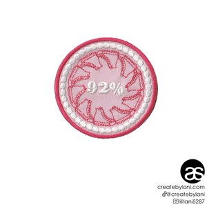 May include: Pink and white embroidered patch with a white circle and a pink starburst design. The text "92%" is embroidered in white inside the starburst.