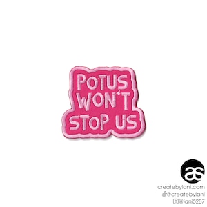 May include: Pink embroidered iron-on patch with the text "POTUS WON'T STOP US".
