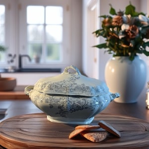 May include: A white and blue floral patterned serving dish with a lid, set on a wooden serving board. The dish has handles and is surrounded by cookies. A vase of flowers is in the background.