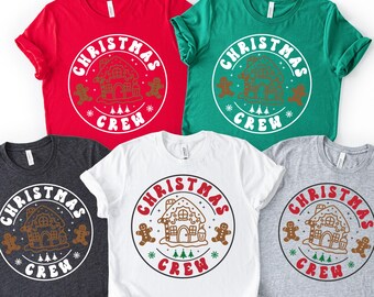 May include: Five short-sleeved t-shirts in red, green, charcoal, white, and gray. Each shirt features a circular design with the text "CHRISTMAS CREW" around a gingerbread house and gingerbread man graphic.