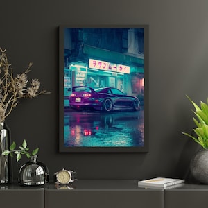 May include: A framed print showing a purple sports car in a neon-lit street scene at night. The car's reflections shimmer on the wet road. The print is framed in black, adding a sleek, modern touch to the artwork.