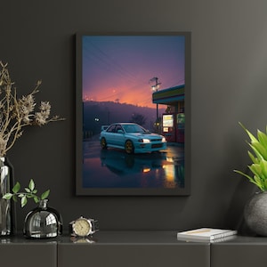 May include: A framed print of a light blue sports car parked near a gas station at dusk. The car has gold-colored rims and a rear spoiler. The sky transitions from orange to purple, reflecting on the wet pavement.