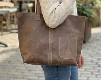 Handgemachte Einkaufstasche aus braunem Leder mit rosa Naht