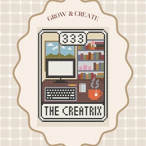 May include: Cross-stitch design featuring a desk scene with a computer, keyboard, and bookshelves. The text "GROW & CREATE" is at the top, and "THE CREATRIX" is at the bottom. The design is set against a beige plaid background.
