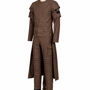May include: A brown costume displayed on a mannequin. The outfit includes a long-sleeved top with shoulder accents, a matching belt, and pants with knee padding. The costume is completed with a long coat and black boots.