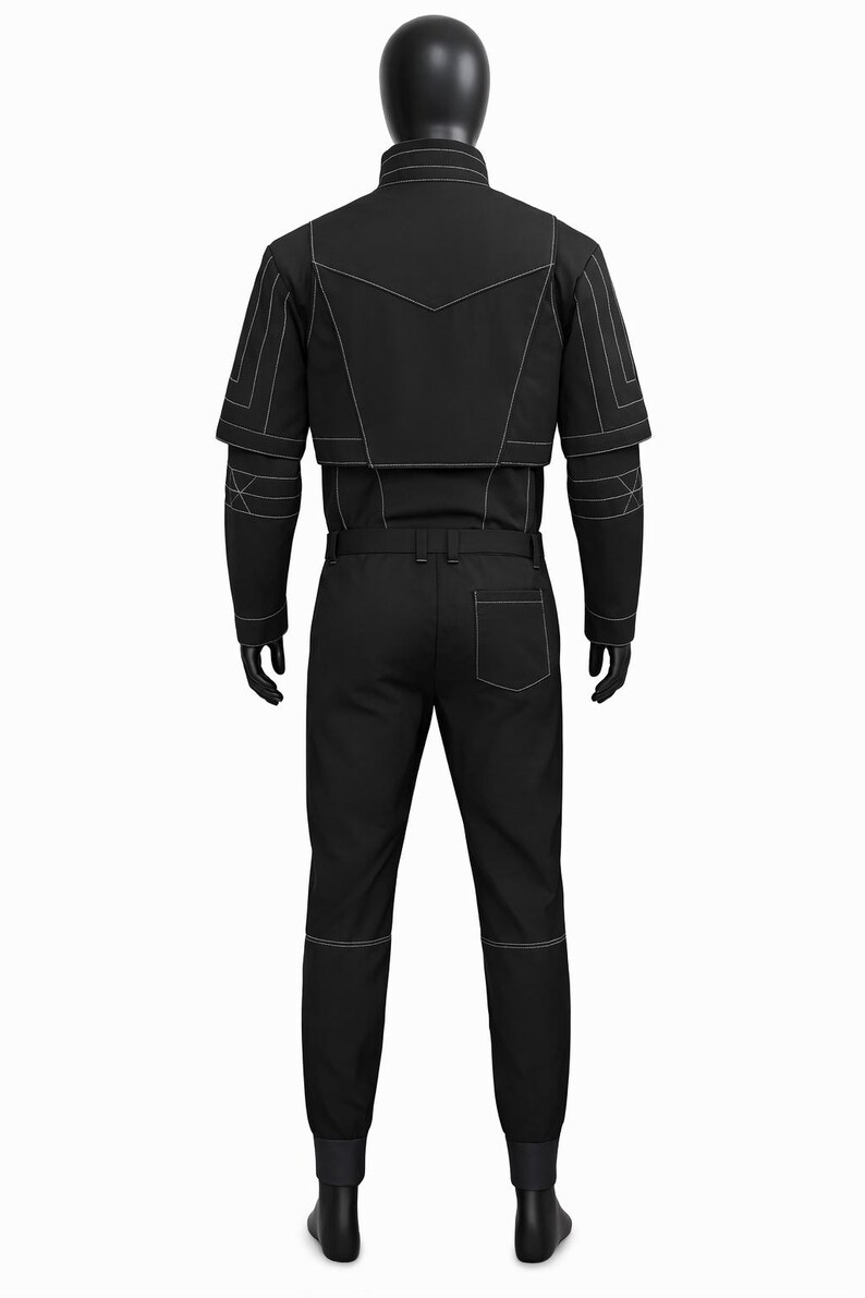 May include: A black jumpsuit with white stitching details. The outfit includes a jacket with geometric accents and matching pants. The mannequin is wearing black gloves and shoes. The overall design is modern and sleek.