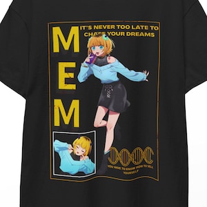 May include: Black t-shirt featuring a colorful anime-style illustration of a girl with the word "MEM" in yellow. The shirt includes the text "IT'S NEVER TOO LATE TO CHASE YOUR DREAMS" and a DNA-like graphic.