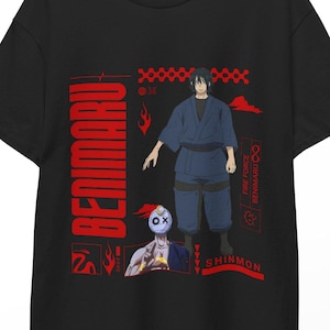 May include: Black t-shirt with a red graphic design featuring the text "BENIMARU" and anime character illustrations. The design includes a character in a blue outfit and another with a mask. The shirt is displayed on a wooden hanger.