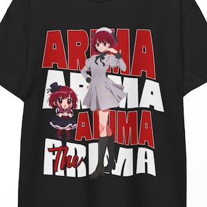 May include: Black t-shirt featuring anime-style graphics and text. The design includes the words "Arima" in red and white, along with two anime character illustrations. The shirt is hanging on a hanger.