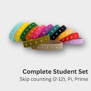May include: A collection of colorful silicone wristbands featuring printed numbers and mathematical sequences. The set includes bands in light blue, yellow, green, orange, pink, purple, teal, black, tan, red, and lavender, with text reading Complete Student Set Skip counting (2-12), Pi, Prime.