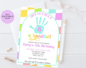 May include: A colorful birthday invitation with the text "OFFICIALLY a handful!" and "Daisy's 5th Birthday." The design includes a handprint, a checkered border, and details for the party. A pencil and clothespins are also visible.