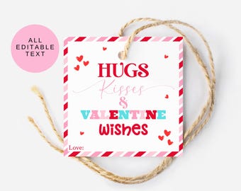 May include: A square gift tag with a red and pink striped border, featuring the text HUGS Kisses & VALENTINE WISHES and Love: in red, pink, and light blue. Small red hearts are scattered across the white background, and a jute twine loop is attached.