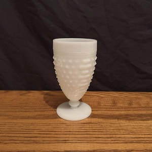 May include: A rustic wooden sign with the text "Welcome to our home" in white lettering. The sign features a distressed finish and a simple, inviting design, perfect for entryway decor.