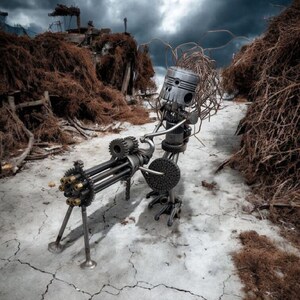 May include: A sculpture made of metal machine parts, resembling a figure with a piston head and a Gatling gun. The artwork is set against a cracked concrete surface and a dramatic, cloudy sky.