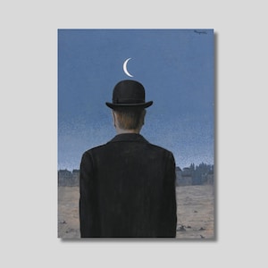 May include: A print of a man in a black coat and bowler hat, facing away from the viewer. A crescent moon is above the hat against a blue sky. The artwork has a surrealist style.