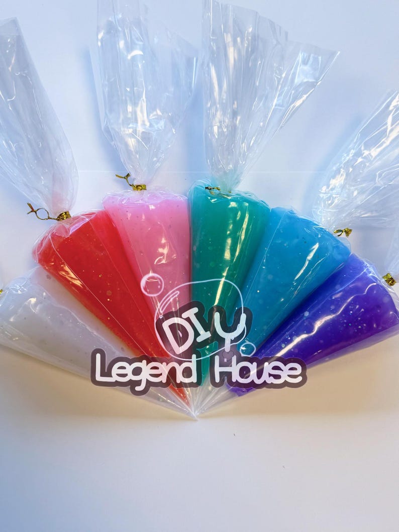 May include: A collection of colorful, glittery slime in clear plastic bags, tied with gold twist ties. The slime colors include white, red, pink, green, blue, and purple. The text "DIY Legend House" is printed on the image.
