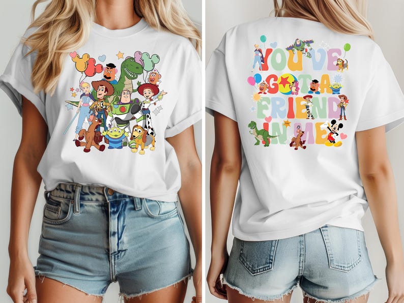 May include: White t-shirt with a vibrant graphic of Toy Story characters, such as Woody, Buzz Lightyear, and Rex. The back of the shirt has the text "You've Got a Friend in Me" and more character illustrations. A cheerful and playful design.