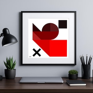Puede incluir: Impresión artística abstracta enmarcada con formas geométricas en rojo, negro y blanco. La obra de arte incluye un rectángulo rojo, un círculo y un triángulo. La impresión se muestra en un escritorio con un portátil, lápices y una pequeña planta.