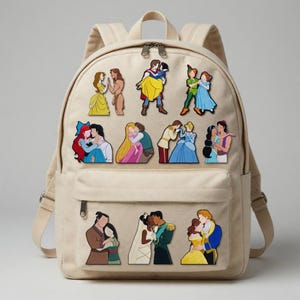 May include: Beige canvas backpack decorated with colorful cartoon images of various couples. The backpack has a front pocket, adjustable straps, and a top handle. The images depict characters from animated movies.