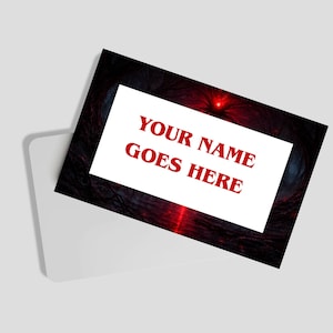 May include: A white card with the text "YOUR NAME GOES HERE" in red, set against a dark, textured background with red and blue accents. The card is partially inserted into a white envelope.