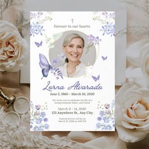 May include: A memorial card with a photo of Lorna Alvarado, surrounded by floral and butterfly illustrations in shades of purple and blue. The card includes dates, a message, and service details.
