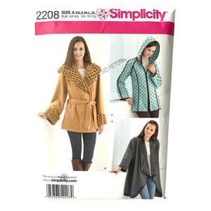 May include: Simplicity sewing pattern 2208 showing three coat designs. The pattern includes a tan coat with a decorative collar and cuffs, a turquoise hooded coat with black polka dots, and a grey coat with embroidered trim. Pattern sizes are XS, S, M, L, XL.