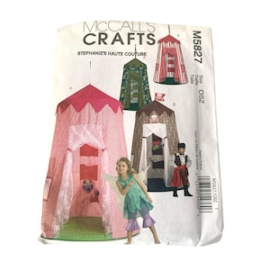 May include: A McCall's Crafts sewing pattern for children's play tents and costumes. The pattern features illustrations of various tent designs in pink, green, and brown, along with a pirate and fairy costume. The pattern number is M5827.