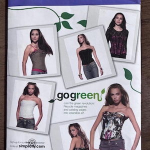 May include: Simplicity sewing pattern envelope featuring images of women in various tops and jeans. The envelope includes the text "go green" and "Join the green revolution! Recycle magazines and catalog pages into wearable art."