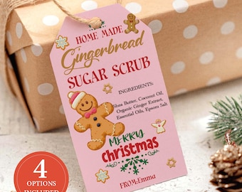 May include: A pink gift tag with the words "Home Made Gingerbread Sugar Scrub" and a gingerbread man illustration. The tag also includes the text "Merry Christmas" and a list of ingredients. A wrapped gift is in the background.
