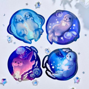 Ensemble d'autocollants en vinyle loutres de mer interstellaires | Bébés loutres de mer dans l'espace, autocollants mignons sur le thème de l'océan et de l'espace, créatures fantastiques