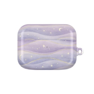 May include: A lavender and white case for wireless earbuds, featuring a watercolor design of a night sky with stars and crescent moons. The case has a rounded rectangular shape with a small loop on the side.