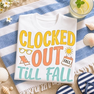 May include: White t-shirt with the words "Clocked Out Till Fall" in yellow, orange, and teal. The shirt features graphics of sunglasses, a beach chair, and a calendar with the word "Fall".