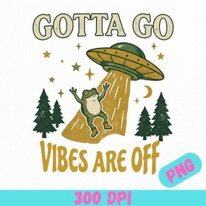 May include: A graphic illustration featuring a green frog being lifted by a yellow UFO beam. The text reads GOTTA GO VIBES ARE OFF. The scene includes dark green pine trees, yellow stars, and a crescent moon against a white background.