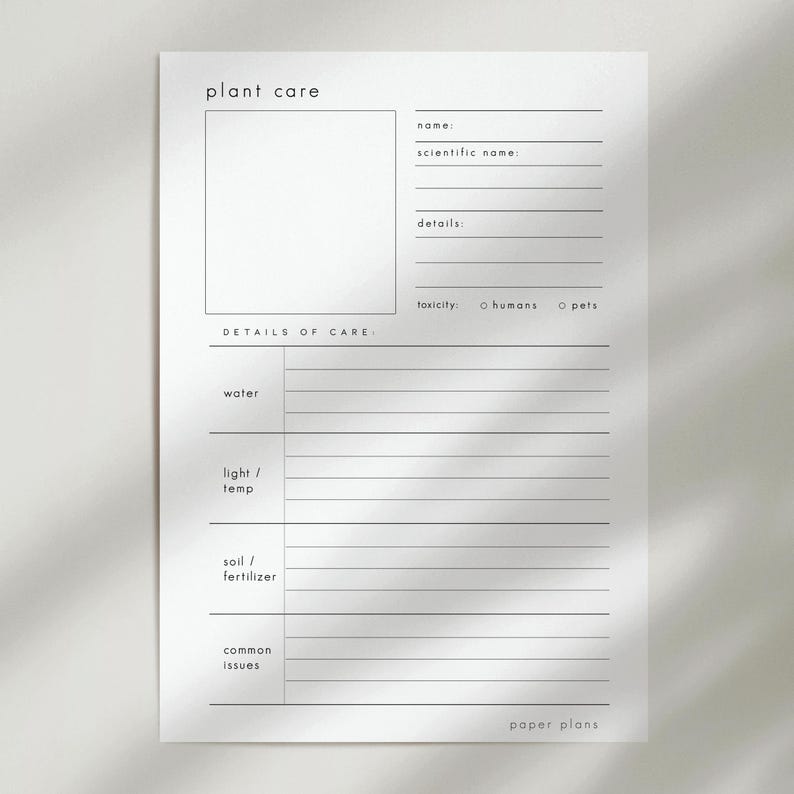 May include: A white plant care sheet with the words "plant care" at the top. The sheet includes sections for plant name, details, and care instructions. The words "paper plans" are at the bottom.