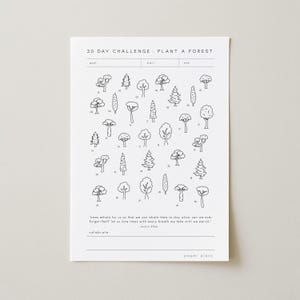 May include: A white paper with a black line drawing of various trees, numbered 1-30, with the text "30 DAY CHALLENGE PLANT A FOREST". Below the trees is a quote and the word "celebrate". The paper is from "paper plans".