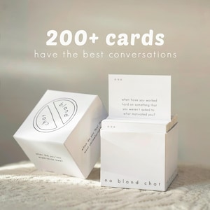 May include: Two white cube-shaped boxes with the text "no bland chat" and "200+ cards have the best conversations." One box is open, revealing conversation cards. The other box is closed, with the words "chat" and "bland" in a circle.