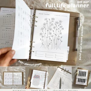 May include: A full life planner with a tan leather cover, open to a mood tracker page with floral illustrations. The planner includes a quarterly plan, 500+ pages, and the text "get our full life planner" and "build your dream planner".