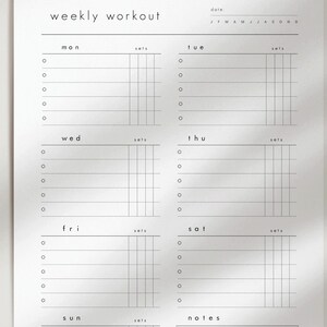 May include: A minimalist weekly workout planner with the text "weekly workout" at the top. The planner is divided into days of the week, with spaces for sets and notes. Each day has circles for tracking progress.