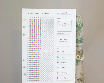 May include: A white paper exercise tracker for the year 2027 with a grid of numbered rows and monthly columns. It features a goal section, a celebrate section, and a color-coded key for activities like run, gym, bike ride, yoga, swimming, and rest day.