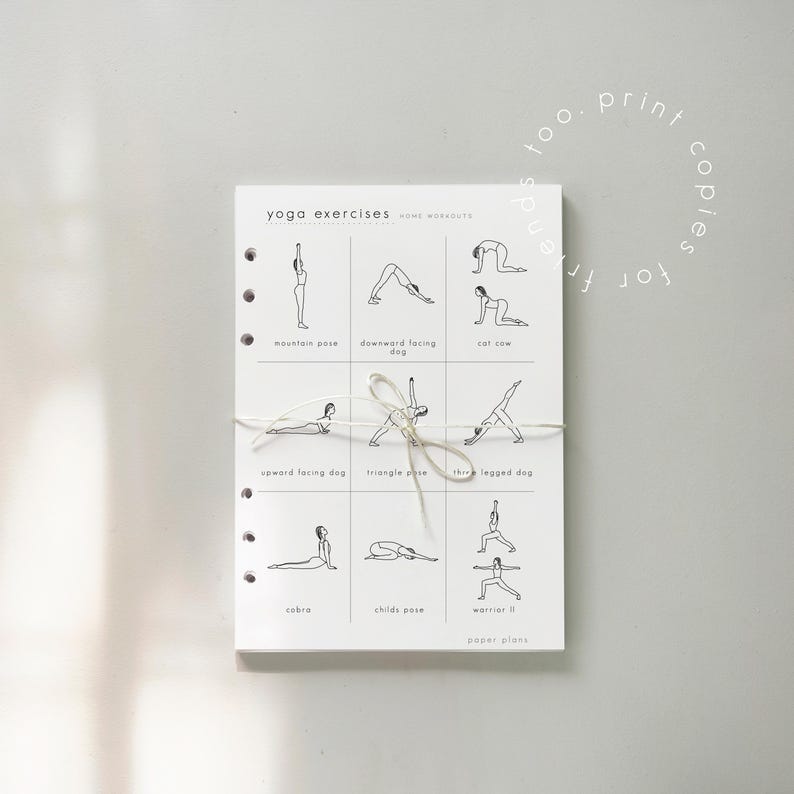 May include: A white notepad featuring black line drawings of yoga poses, including downward facing dog and triangle pose. The notepad is tied with twine and has the text "yoga exercises home workouts" and "too print copies for friends".