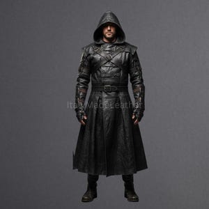 May include: A full-length black leather hooded coat with a belt, buckles, and gloves. The coat has a long skirt and is worn with boots. The image is set against a gray background.